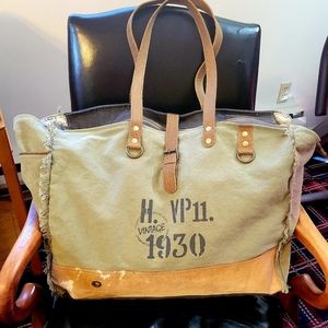 Super nice Myra tote bag. Approximately. 15Hx20W. Canvas/Cowhide/Leather